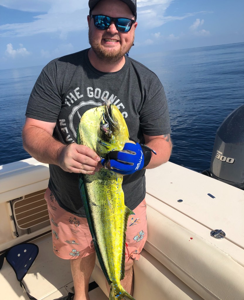 Man holding a Mahi on a Vieques deep sea fishing charter