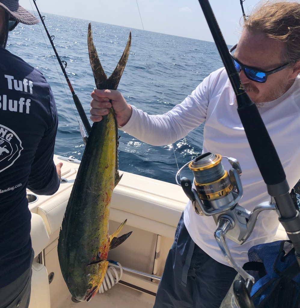 Man holding a Mahi on a Vieques fishing charter