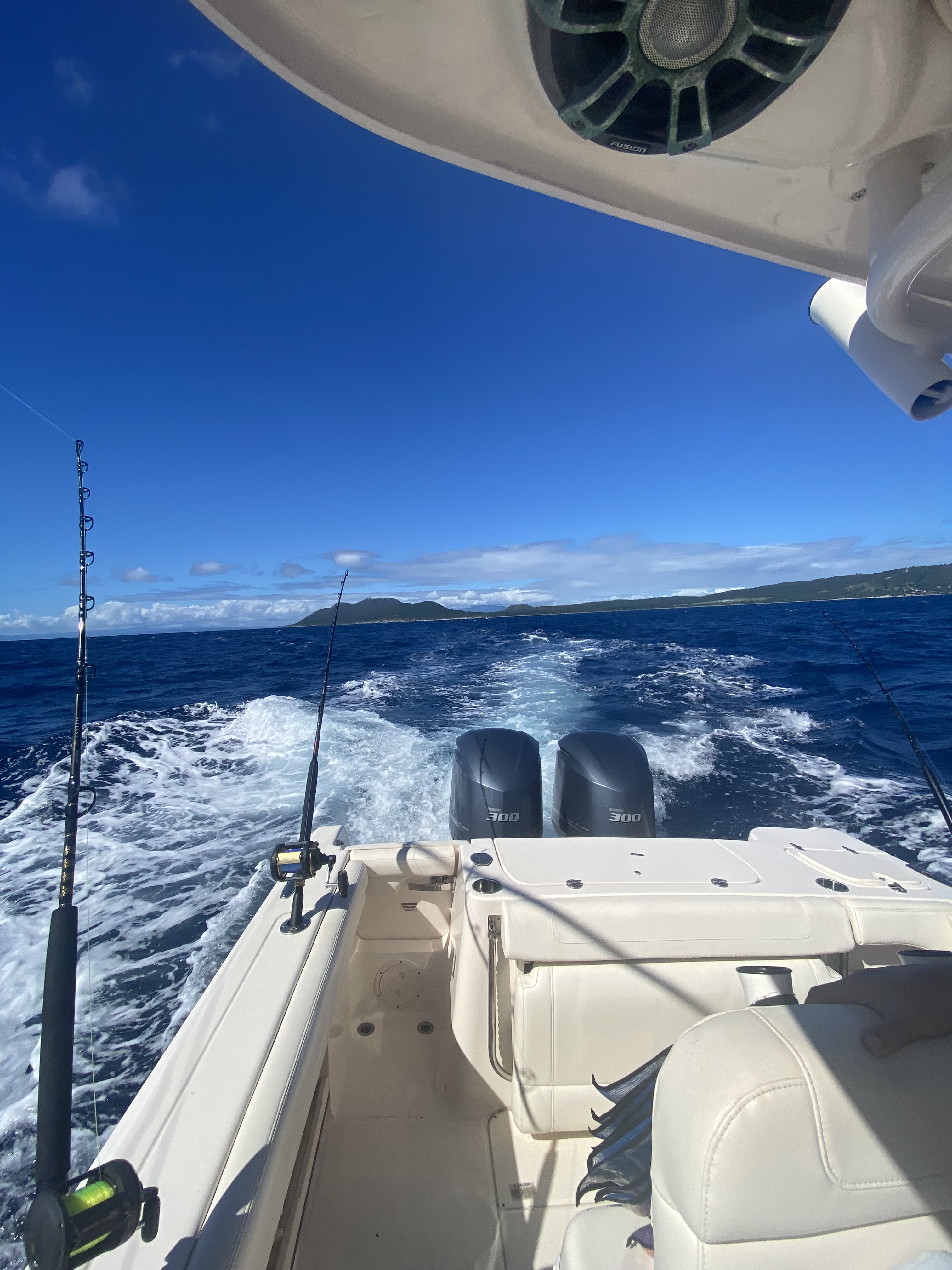 Mountain and ocean view off the back of the boat of a Vieques fishing charter