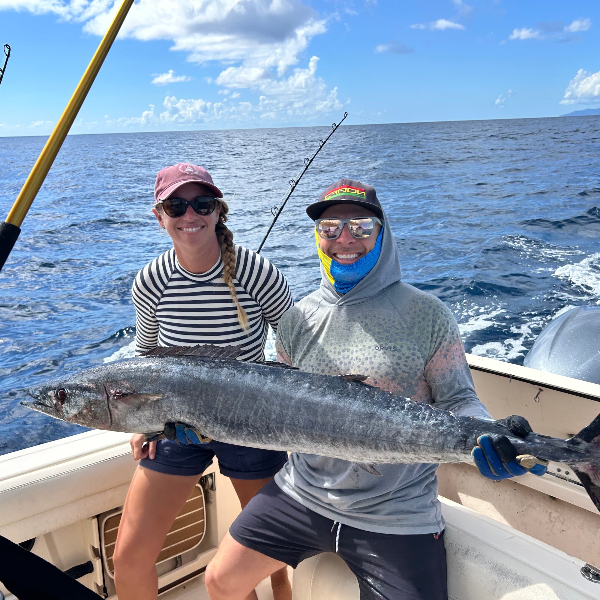 a couple holding a 60 pound Wahoo on a Vieques Charter with Vieques Blue Water Charters