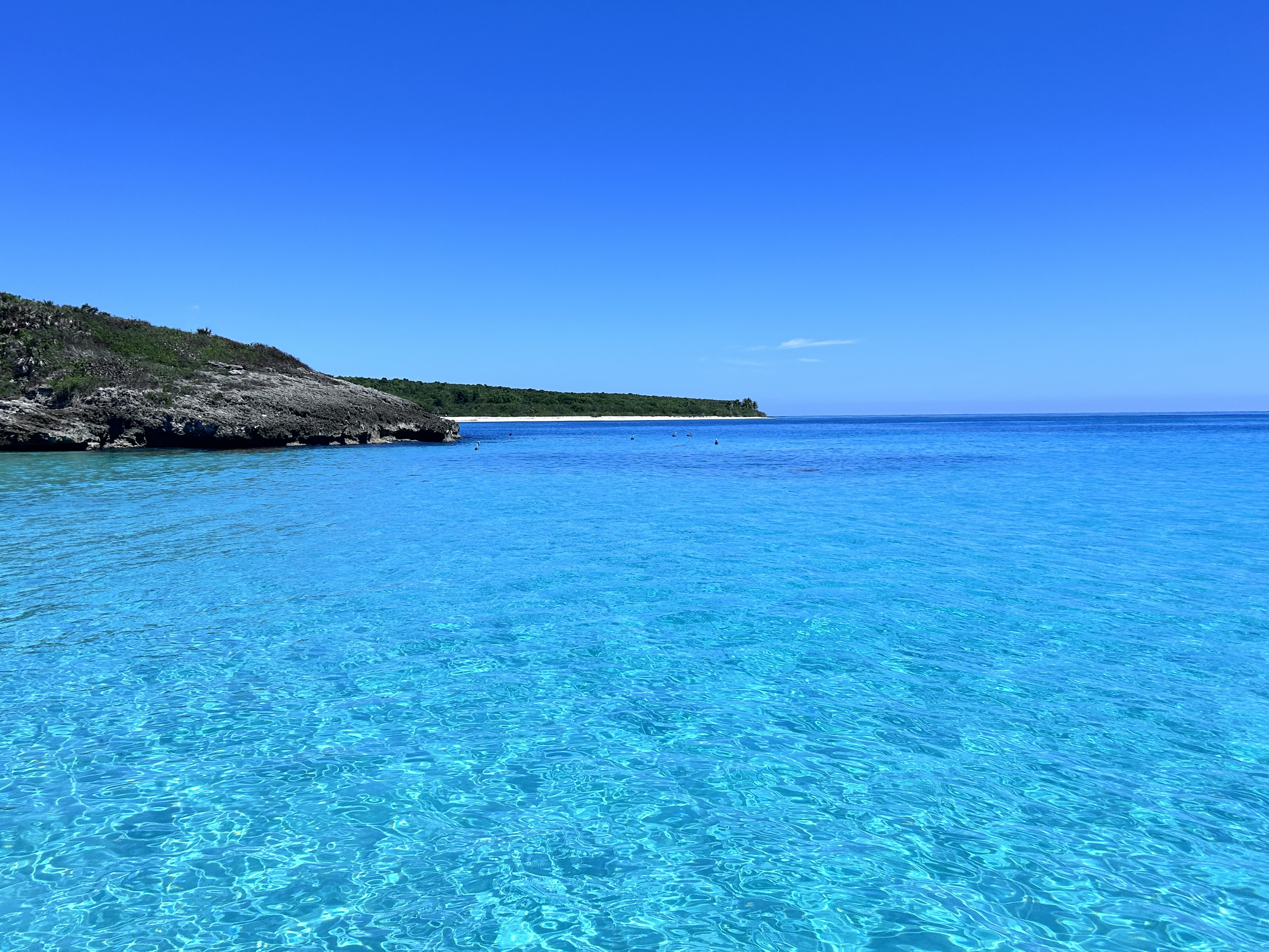 bright blue vieques water with cliff in the distance